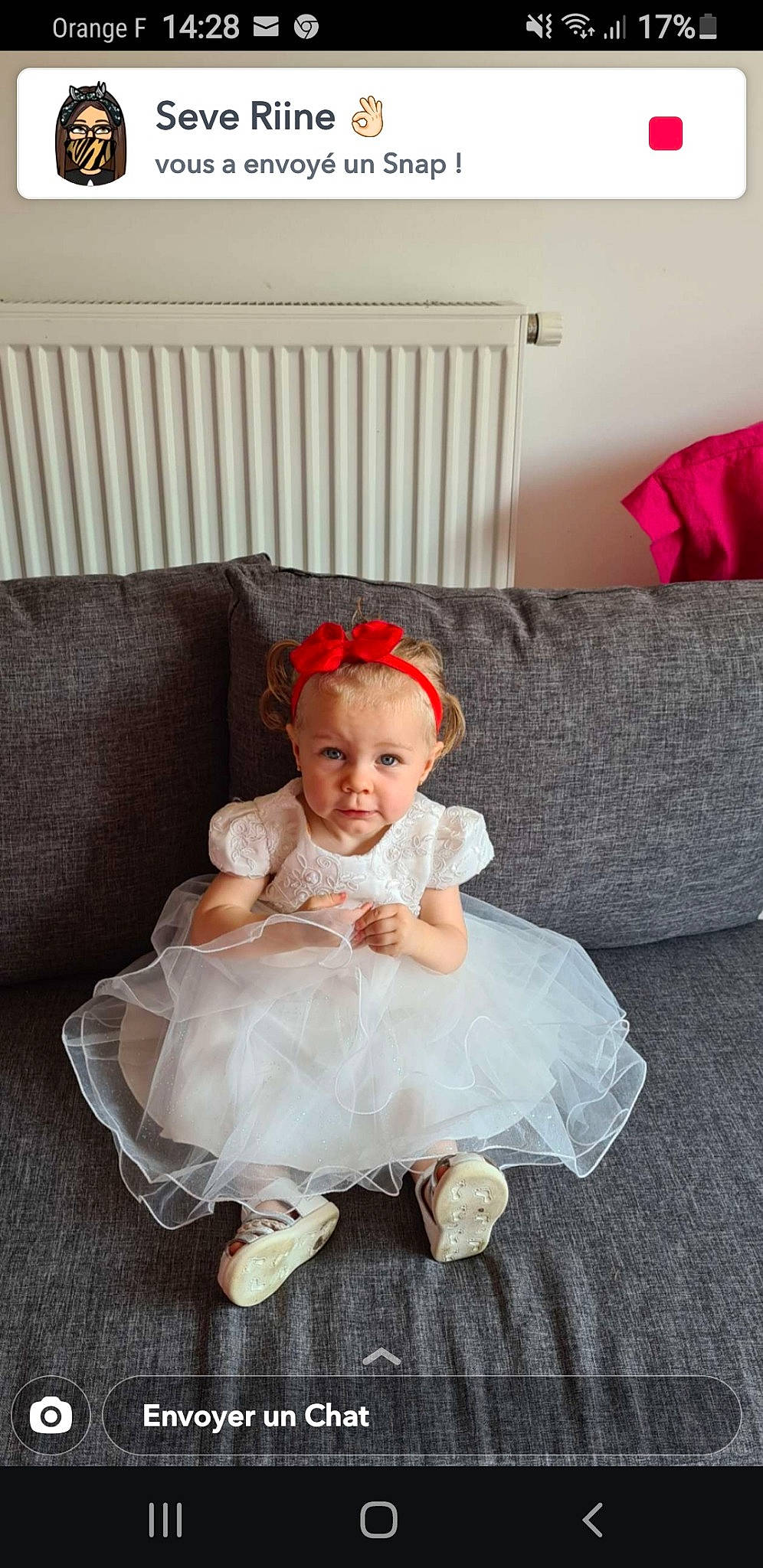 Nina participe au concours pour gagner de l'argent avec cette photo : baby, baby_toddler_clothing, bridal_accessory, comfort, couch, dress, event, eye, fashion_accessory, flash_photography, flooring, happy, headpiece, linens, living_room, person, pink, room, textile, throw_pillow