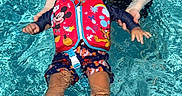 Giovanni joined the competition — help win amazing prizes! baby, child, sunglasses, life_jacket, mickey_mouse, water, pool, swimming, floating, adult_hands, summer, sunny, blue, splash, fun, outdoor, clothing, swimwear, cute, happy