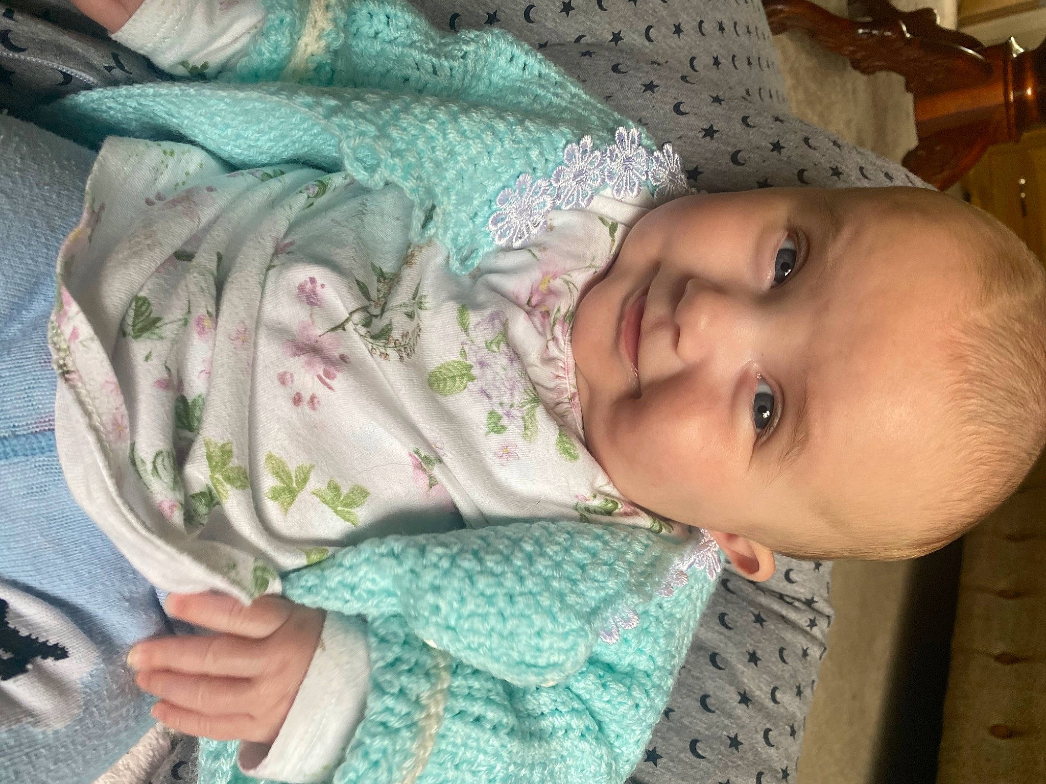 Lily is registered to the contest to win money with this photo: baby, baby_products, baby_toddler_clothing, cheek, child, comfort, eye, eyelash, green, happy, iris, lip, mouth, nose, pattern, person, skin, sleeve, smile, toddler