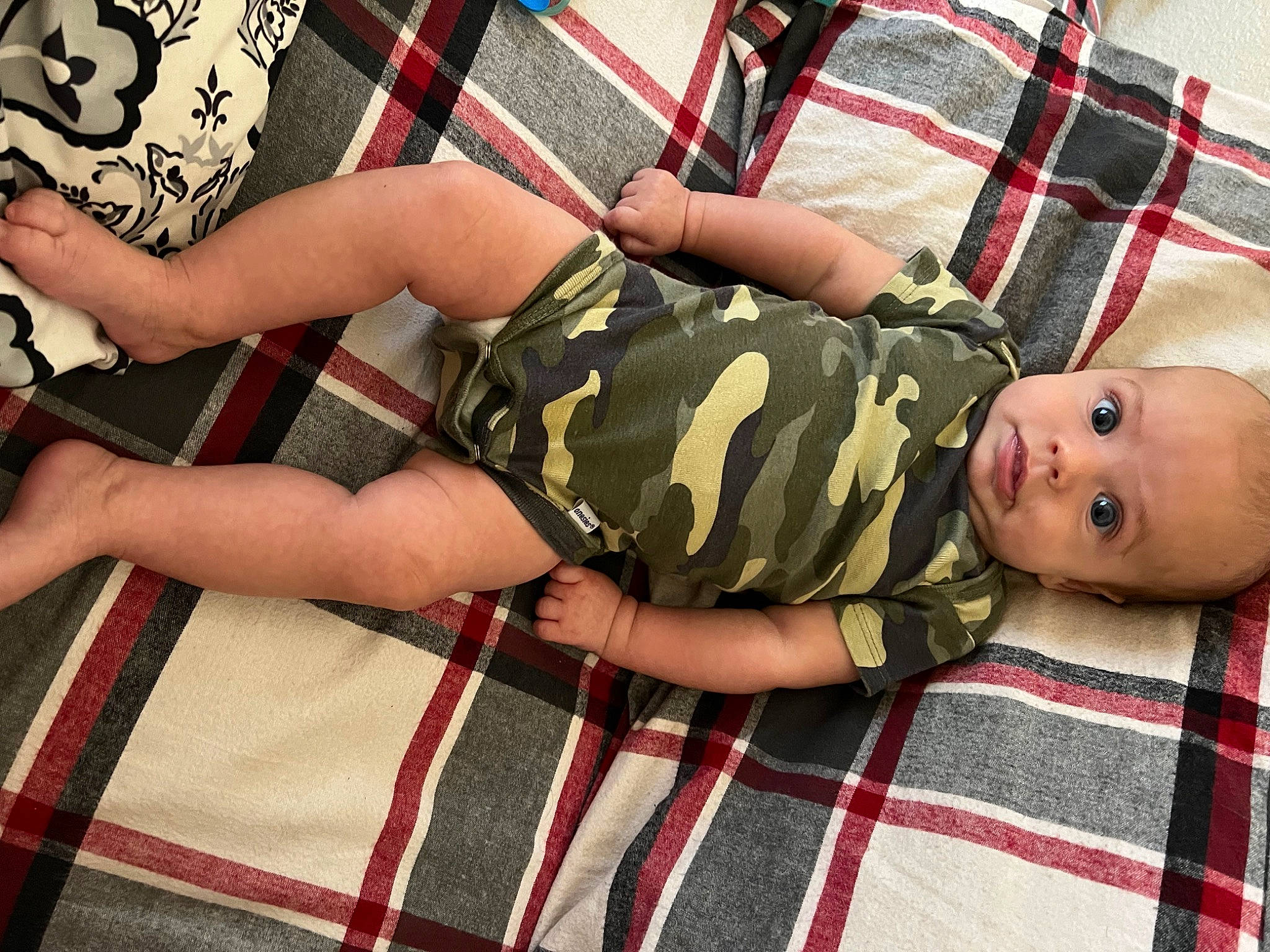 Grayson joined the competition — help win amazing prizes! baby, baby_toddler_clothing, comfort, flooring, foot, human_body, human_leg, joint, knee, leg, nail, pattern, person, plaid, red, sleeve, tartan, textile, thigh, toddler