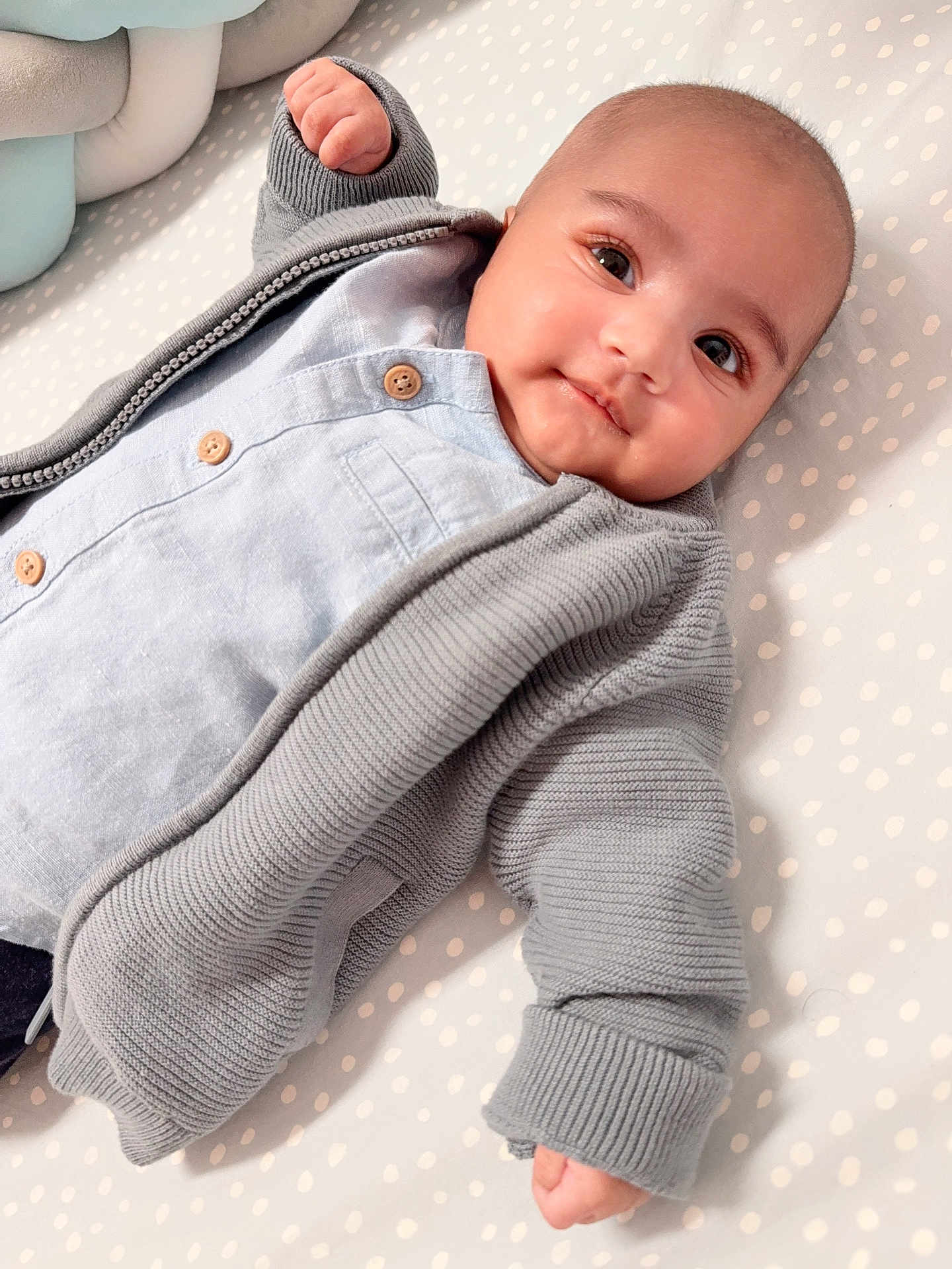 Yunus Azaan joined the competition — help win amazing prizes! baby, infant, face, eyes, hand, clothing, sweater, shirt, button, blanket, polka_dot, lying_down, cute, portrait, child, newborn, soft, cozy, indoors, skin