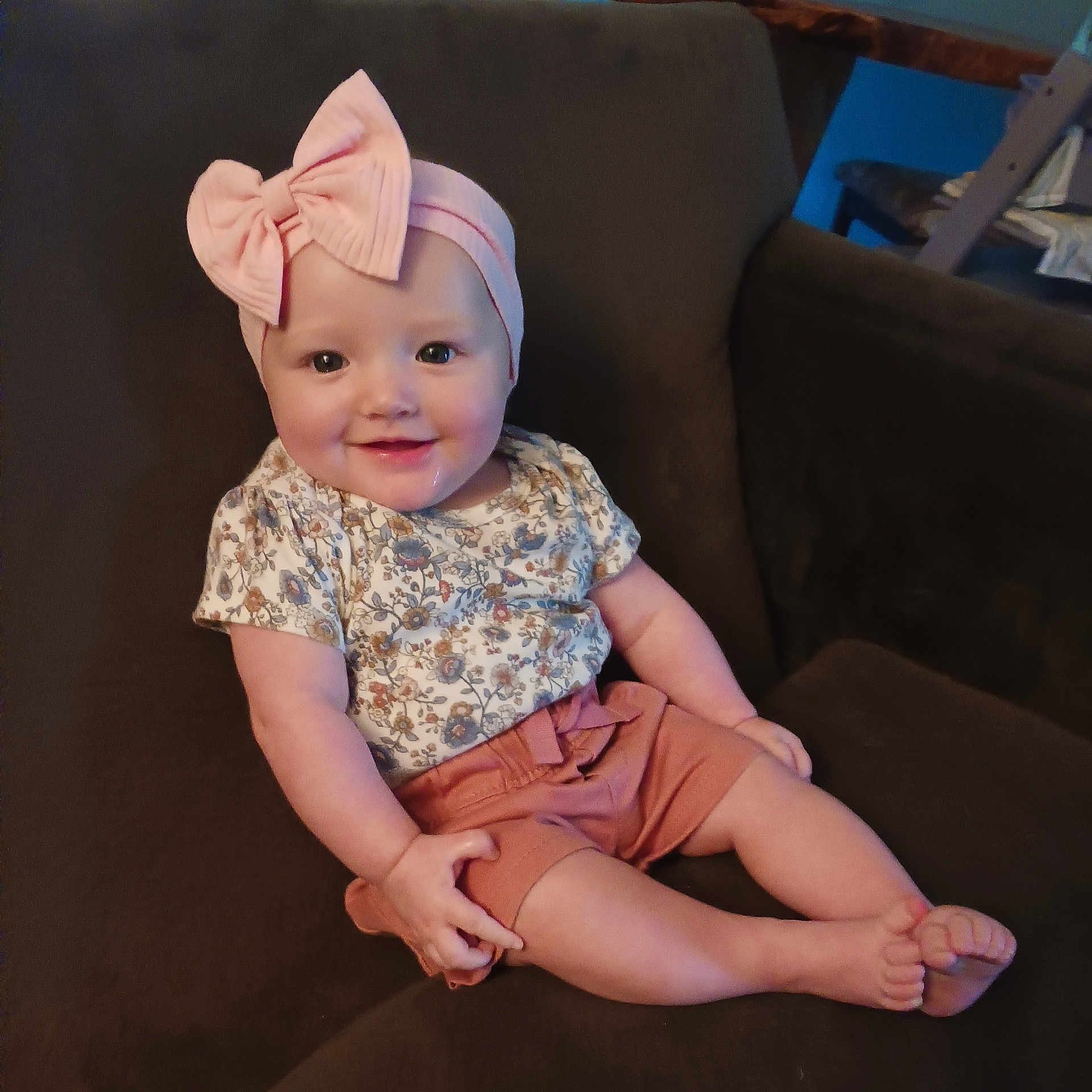 Claire is registered to the contest to win money with this photo: accessories, baby, bodypart, chair, clothing, couch, cushion, dress, face, finger, furniture, hand, hat, head, headband, homedecor, person, photography, portrait, sitting