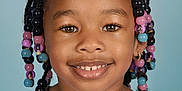 Madison joined the competition — help win amazing prizes! background, beads, braids, child, closeup, clothing, colorful, earrings, eyes, face, girl, hair, happy, person, portrait, purple, smile, studio, velvet, young