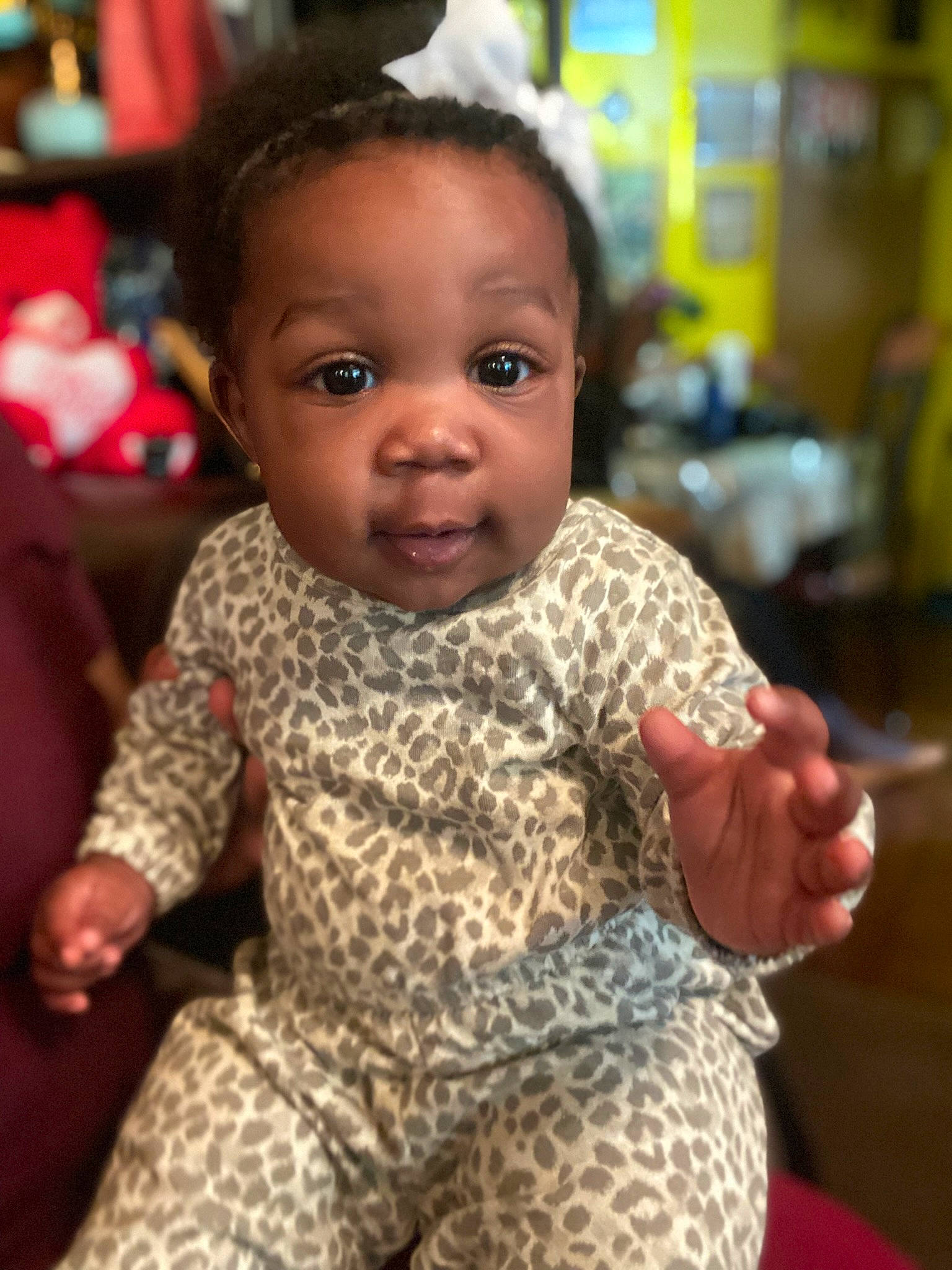 Treasure is registered to the contest to win money with this photo: baby, baby_toddler_clothing, cheek, chin, eye, face, facial_expression, finger, fun, hairstyle, hand, happy, head, iris, nose, person, skin, sleeve, standing, thumb