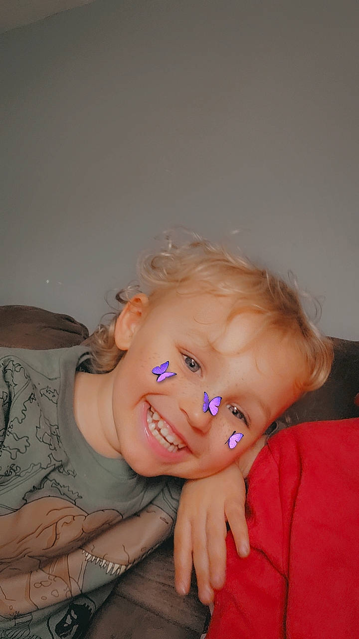 Mason is registered to the contest to win money with this photo: baby, cheek, comfort, ear, eye, eyebrow, flash_photography, gesture, glasses, hand, happy, head, human_body, iris, joy, lip, mouth, nose, person, skin