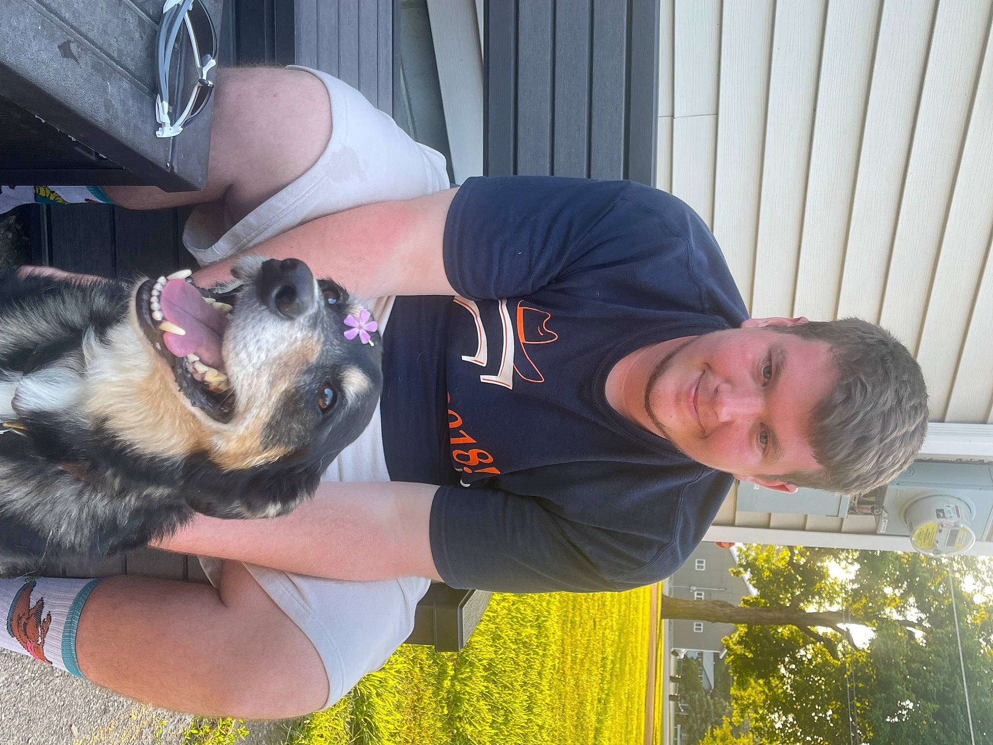 Buddy is registered to the contest to win money with this photo: canidae, carnivore, companion_dog, dog, dog_breed, elbow, eyewear, fun, fur, gesture, grass, happy, herding_dog, king_shepherd, plant, smile, sporting_group, t_shirt, working_dog, wrist