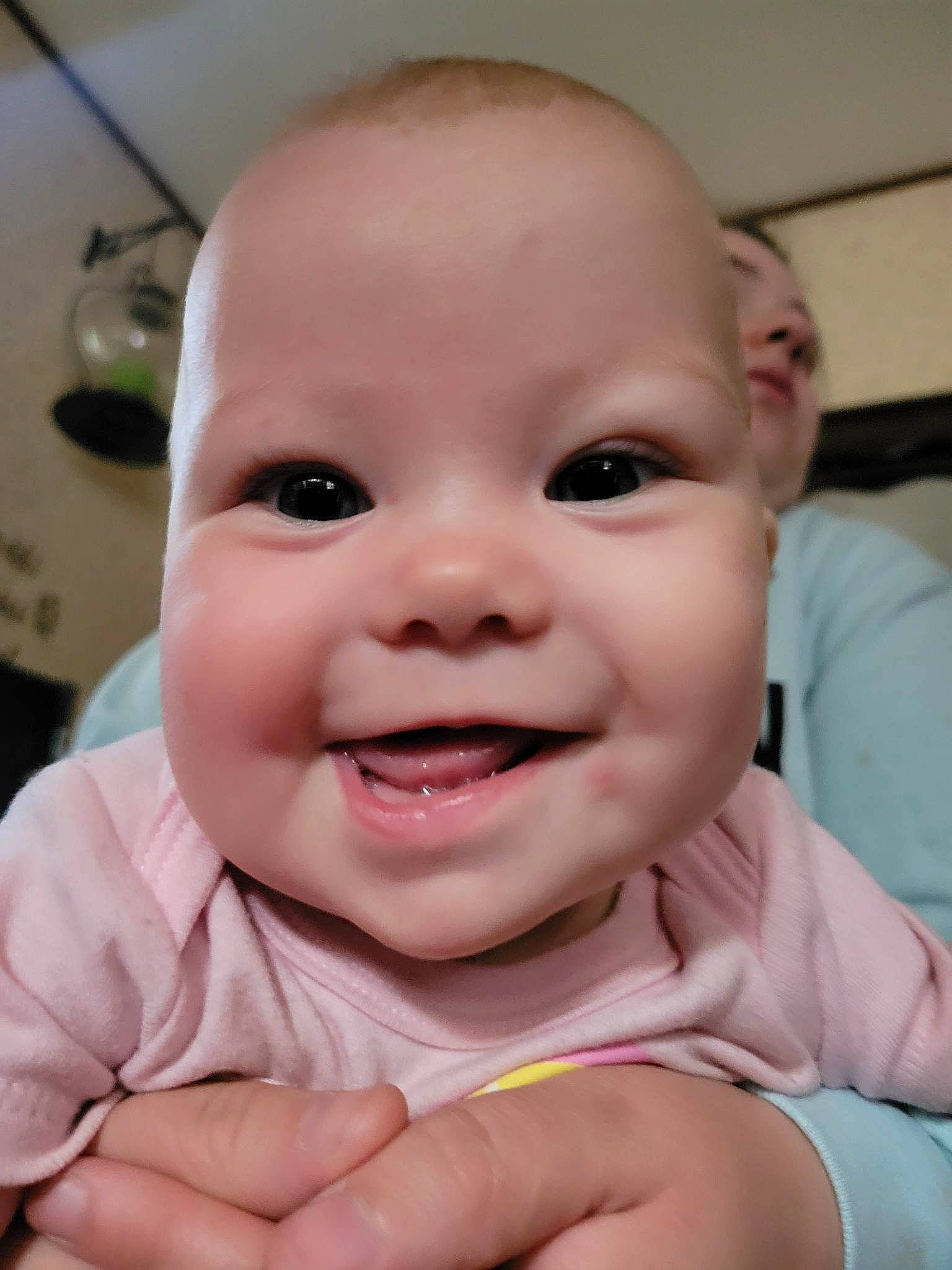 Navii is registered to the contest to win money with this photo: baby, baby_laughing, baby_toddler_clothing, cheek, ear, eyebrow, eyelash, finger, gesture, happy, iris, joy, lip, mouth, nose, person, pink, skin, smile, thumb