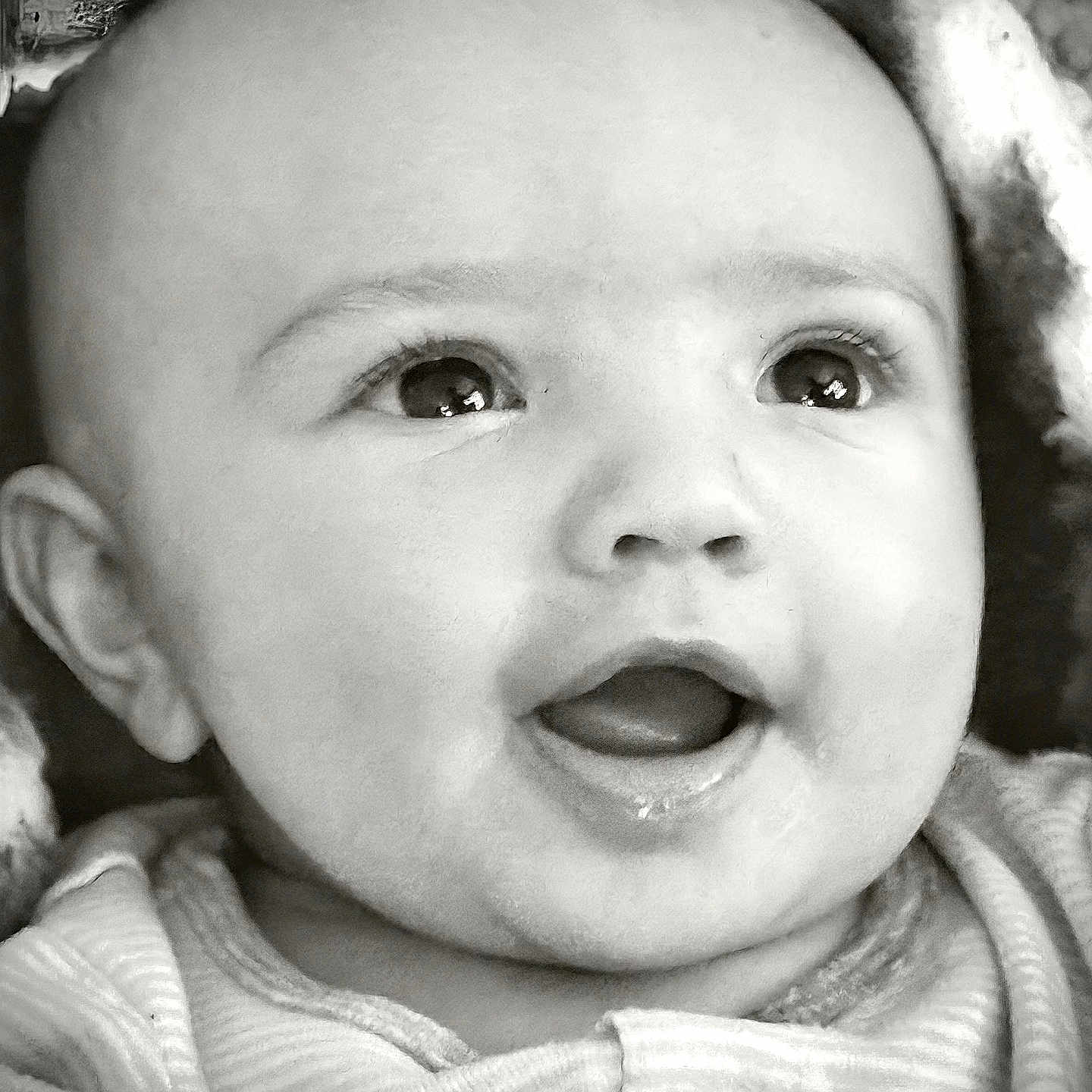 Zeke joined the competition — help win amazing prizes! baby, infant, face, eyes, mouth, smile, expression, blanket, clothing, portrait, closeup, head, cute, newborn, child, soft, black_and_white, happy, cozy, young