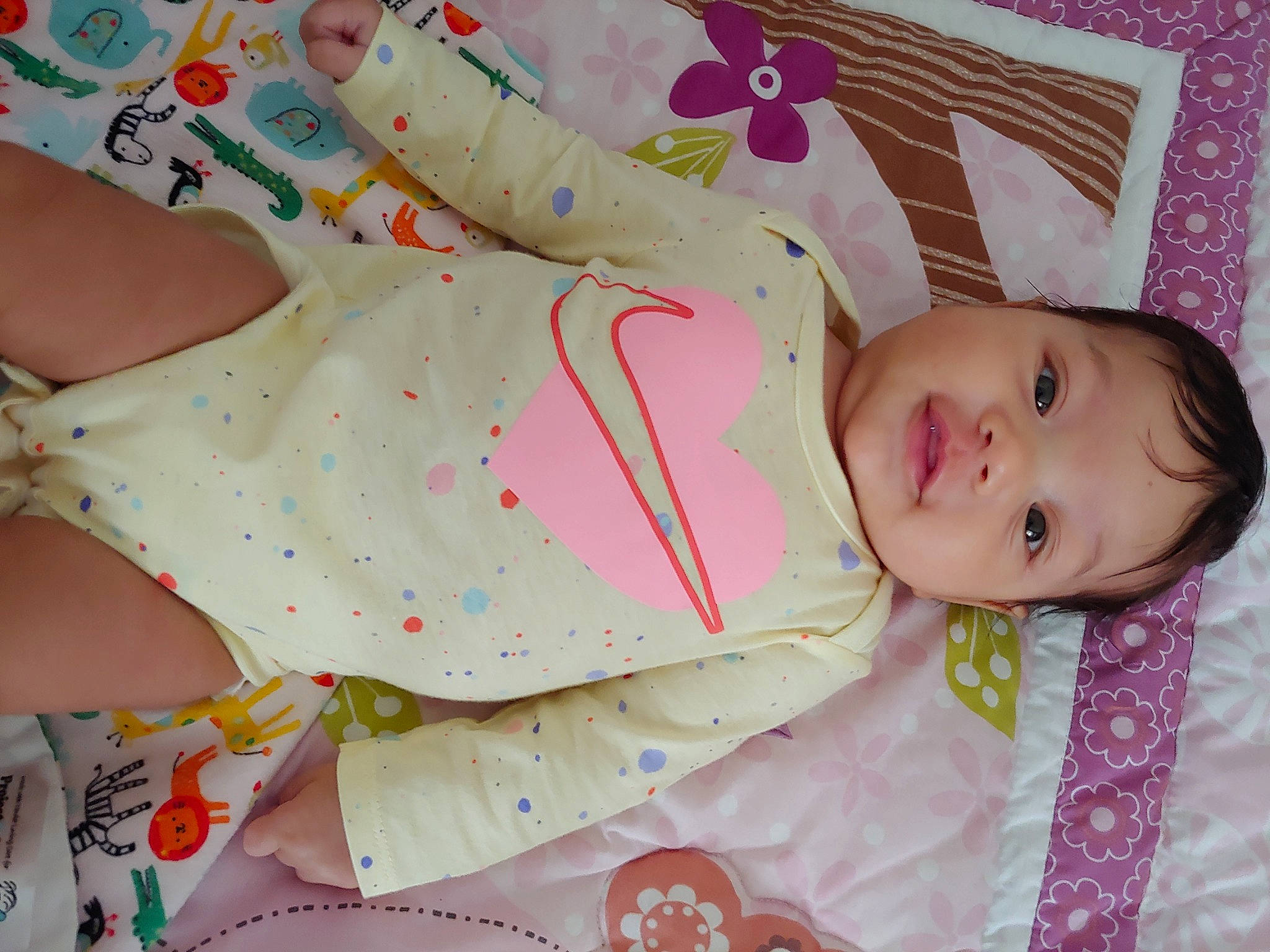 Malina is registered to the contest to win money with this photo: baby, baby_products, baby_toddler_clothing, bedding, cheek, child, clothing, comfort, dress, face, hand, linens, pattern, person, pink, room, skin, sleeve, smile, toddler