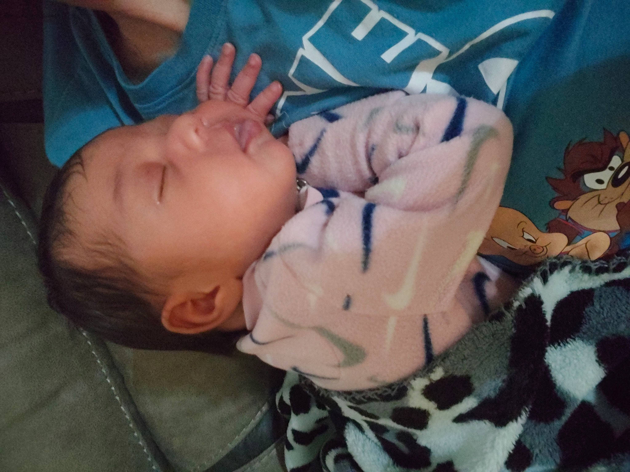 Malina is registered to the contest to win money with this photo: arm, baby, baby_toddler_clothing, cheek, child, comfort, finger, gesture, hand, happy, linens, military_camouflage, nose, person, room, sitting, skin, thumb, toddler, toy