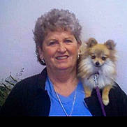 Valentine joined the competition — help win amazing prizes! woman, dog, small_dog, pet, smile, portrait, indoor, leash, casual_clothing, gray_hair, earrings, blue_shirt, black_jacket, fluffy, cute, companion, shoulder_pet, friendly, happy, middle_aged