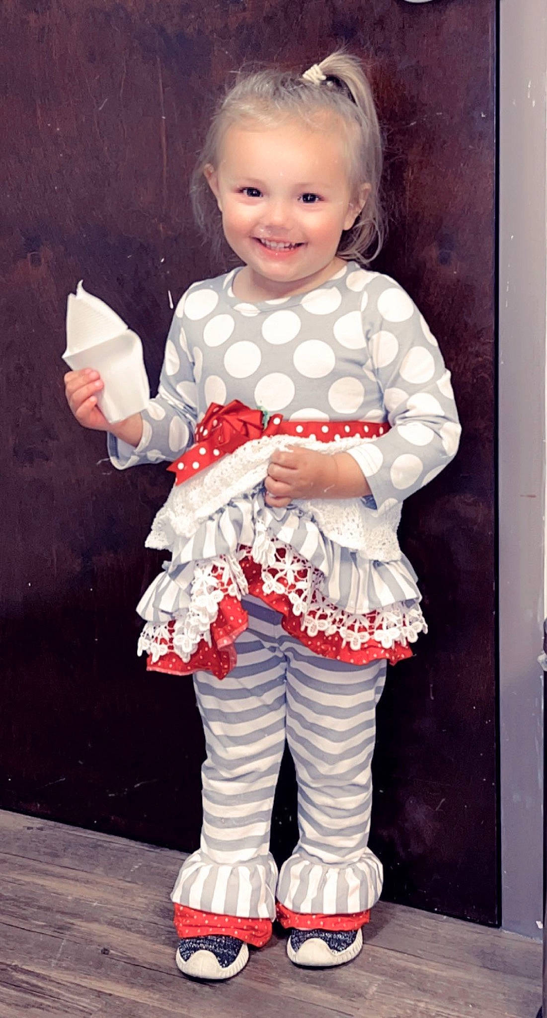 Riley is registered to the contest to win money with this photo: baby_toddler_clothing, carmine, child, day_dress, dress, event, fashion_design, flash_photography, gesture, happy, human_leg, joy, knee, one_piece_garment, pattern, person, pink, sleeve, smile, sock