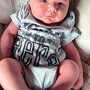 Ralph is registered to the contest to win money with this photo: baby, bed, blanket, clothing, couch, cushion, face, furniture, glove, head, homedecor, hosiery, newborn, pants, person, photography, portrait, sleeping, sock, t_shirt