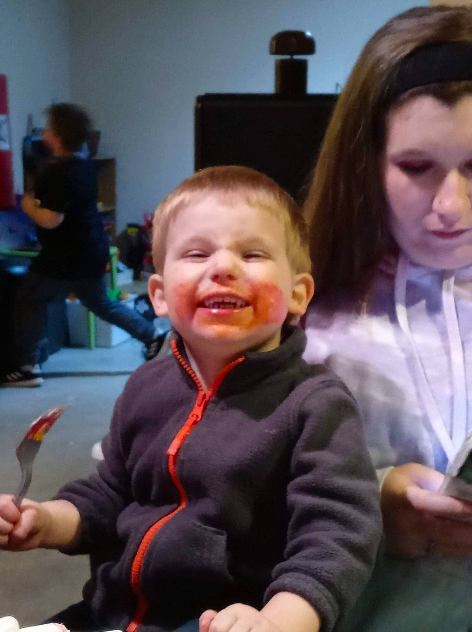 Lance is registered to the contest to win money with this photo: chair, cheek, child, conversation, event, fun, hair, hairstyle, happy, head, iris, joy, laugh, people, person, recreation, room, sharing, sitting, smile