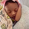 Arimani Rhian is registered to the contest to win money with this photo: newborn, baby, sleeping, portrait, pink_bow, headband, blanket, swaddled, cozy, infant, face, closed_eyes, indoors, cuddled, soft_lighting, close_up, peaceful, parent, clothing, textile