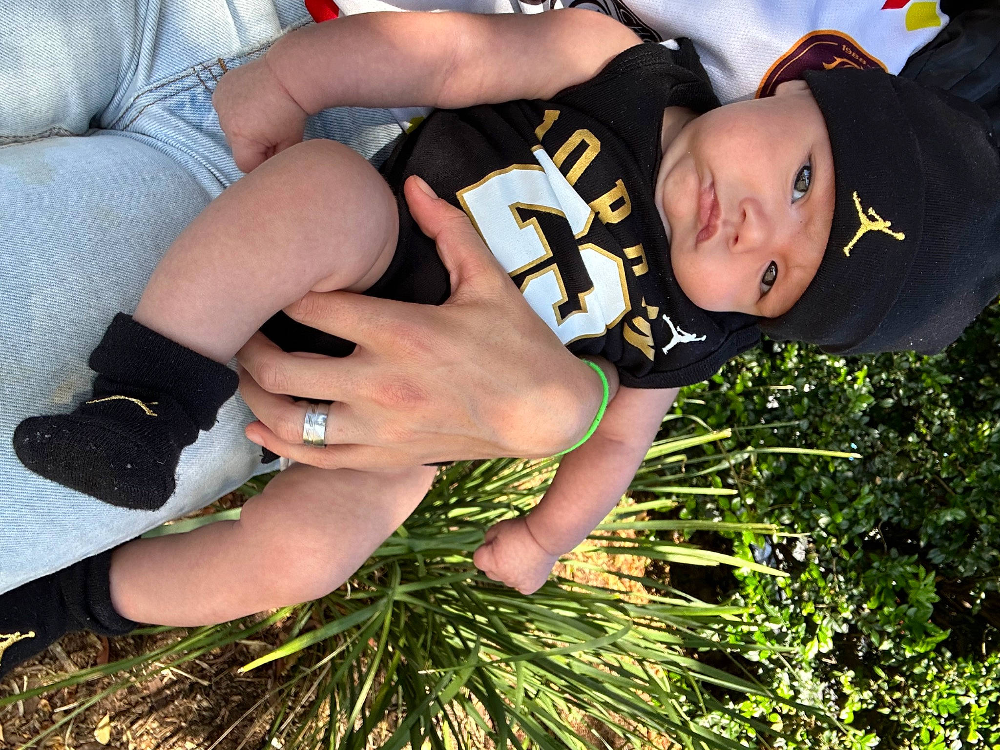 Malakai is registered to the contest to win money with this photo: baby, baby_toddler_clothing, event, finger, fun, gesture, grass, happy, hat, headwear, human_leg, lawn, nail, people_in_nature, person, plant, sleeve, spring, thigh, thumb