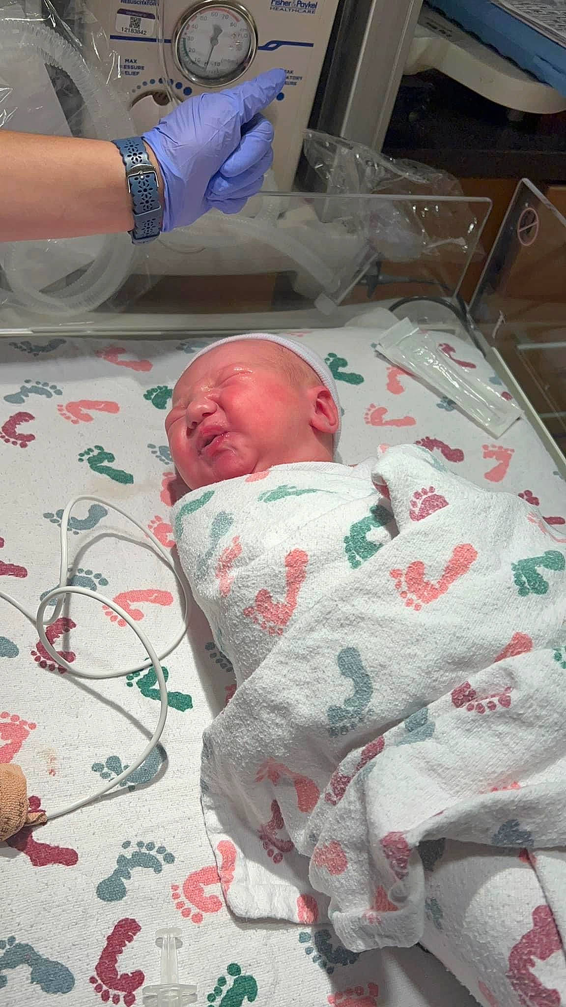 Drew is registered to the contest to win money with this photo: baby, baby_products, bed, bed_sheet, bedding, child, comfort, event, health_care, hospital, linens, medical, medical_equipment, medical_procedure, patient, pattern, person, room, service, textile