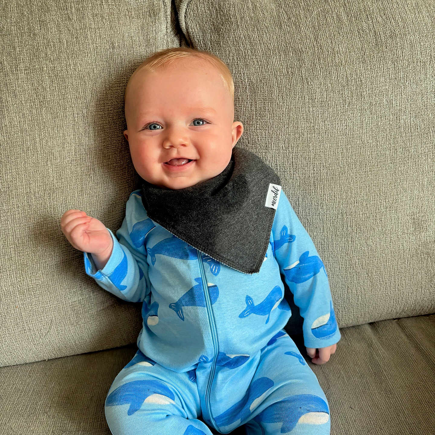 Jaxon is registered to the contest to win money with this photo: baby, babylaughing, bodypart, clothing, couch, cushion, face, finger, furniture, hand, happy, head, homedecor, pajamas, pants, person, photography, portrait, sitting, smile