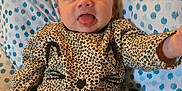 Samantha joined the competition — help win amazing prizes! baby, black_skirt, blanket, blue, cat_face, child, clothing, cute, happy, indoor, infant, leopard_print, person, polka_dot, portrait, shirt, smiling, tongue_out, tutu, white