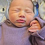 Samantha is registered to the contest to win money with this photo: newborn, baby, sleeping, headphones, purple_sweater, blanket, hand, face, cozy, soft, infant, child, cute, peaceful, resting, indoors, closeup, portrait, tiny_hand, relaxed