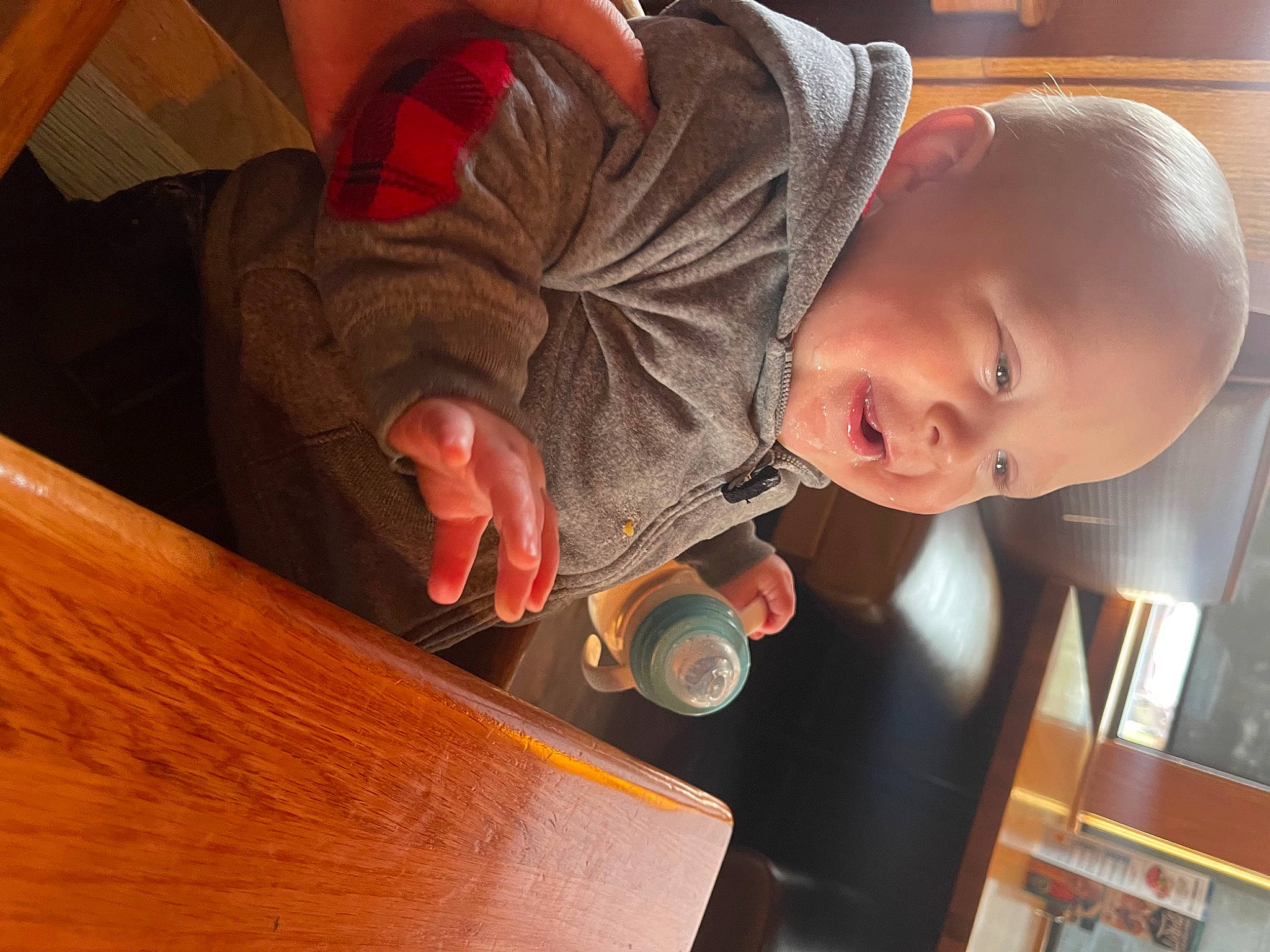 Theo joined the competition — help win amazing prizes! baby, baby_toddler_clothing, child, countertop, flooring, fun, hardwood, indoor_games_and_sports, person, plywood, room, sitting, table, toddler, varnish, wood, wood_stain