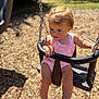 toddler, child, swing, playground, outdoor, sunlight, pink_clothing, baby, barefoot, summer, playtime, seat, wood_chips, chain, daylight, person, cute, young_child, safety_bar, nature