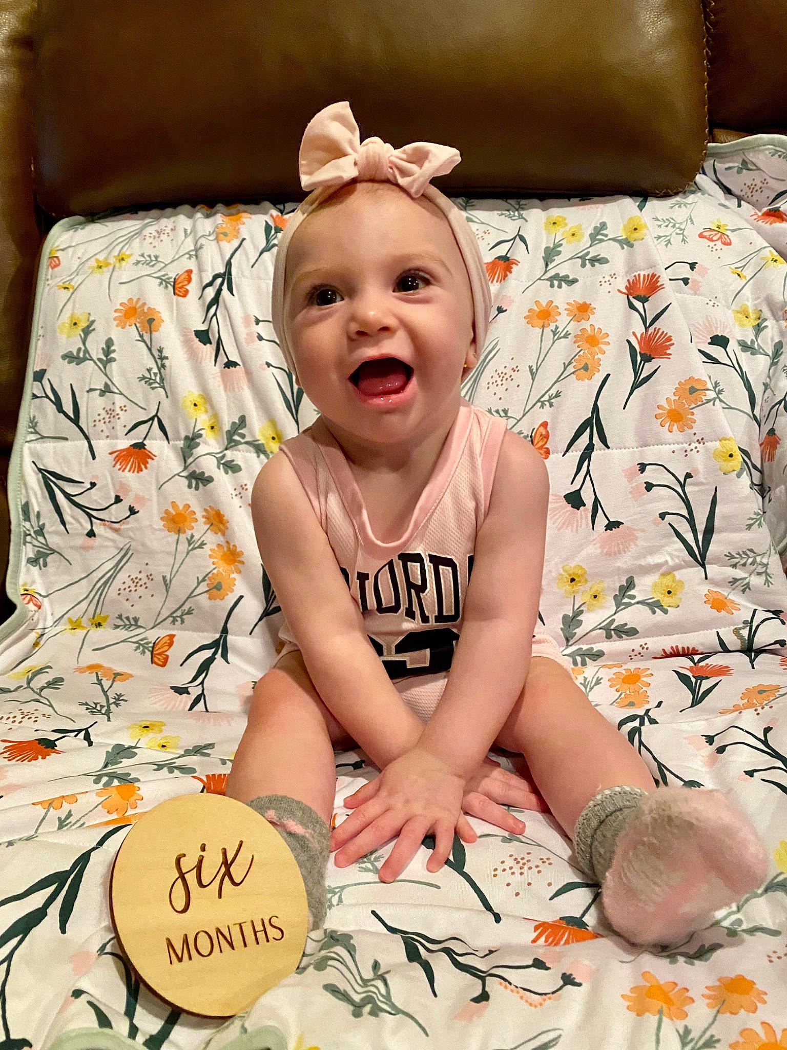 Charley is registered to the contest to win money with this photo: baby, baby_toddler_clothing, beauty, child, comfort, facial_expression, finger, fun, happy, orange, pattern, people, person, pink, product, skin, smile, textile, toddler, white