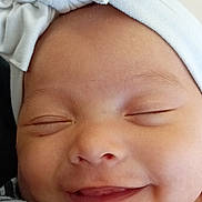 A'Myia is registered to the contest to win money with this photo: baby, cheek, chin, comfort, eye, eyebrow, face, facial_expression, gesture, hand, human, human_body, lip, mouth, nose, photograph, product, skin, smile, white