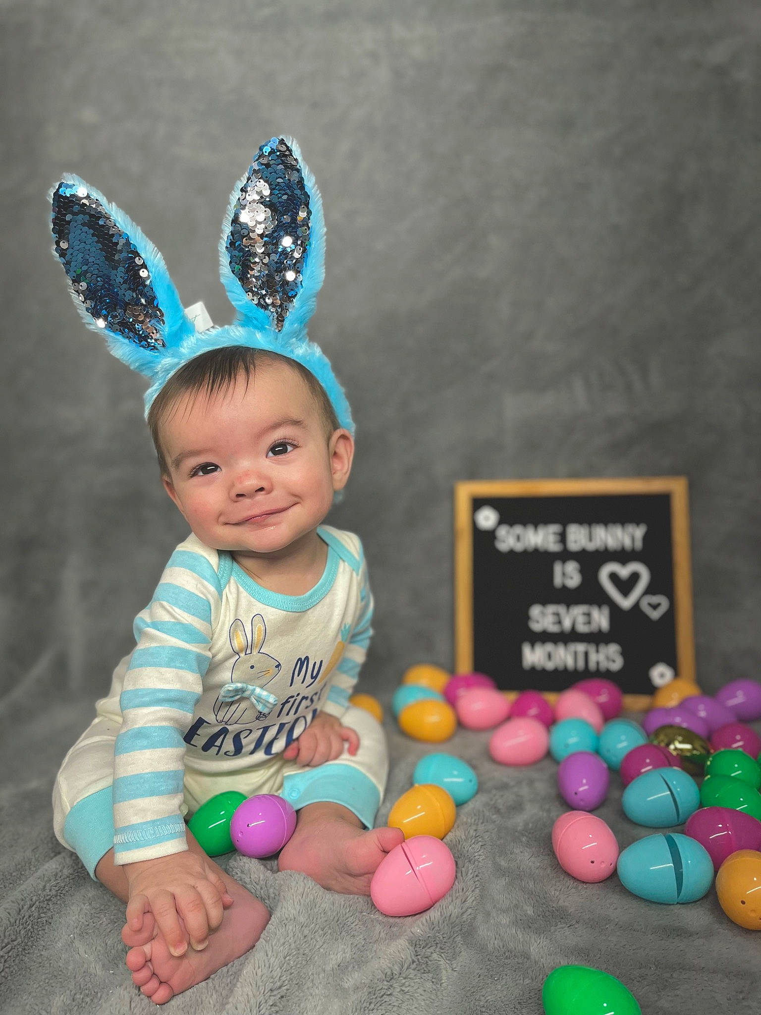 Cassius joined the competition — help win amazing prizes! baby_toddler_clothing, balloon, child, costume_hat, easter, event, finger, fun, grass, happy, hat, headband, joy, magenta, party_supply, person, photograph, pink, product, smile