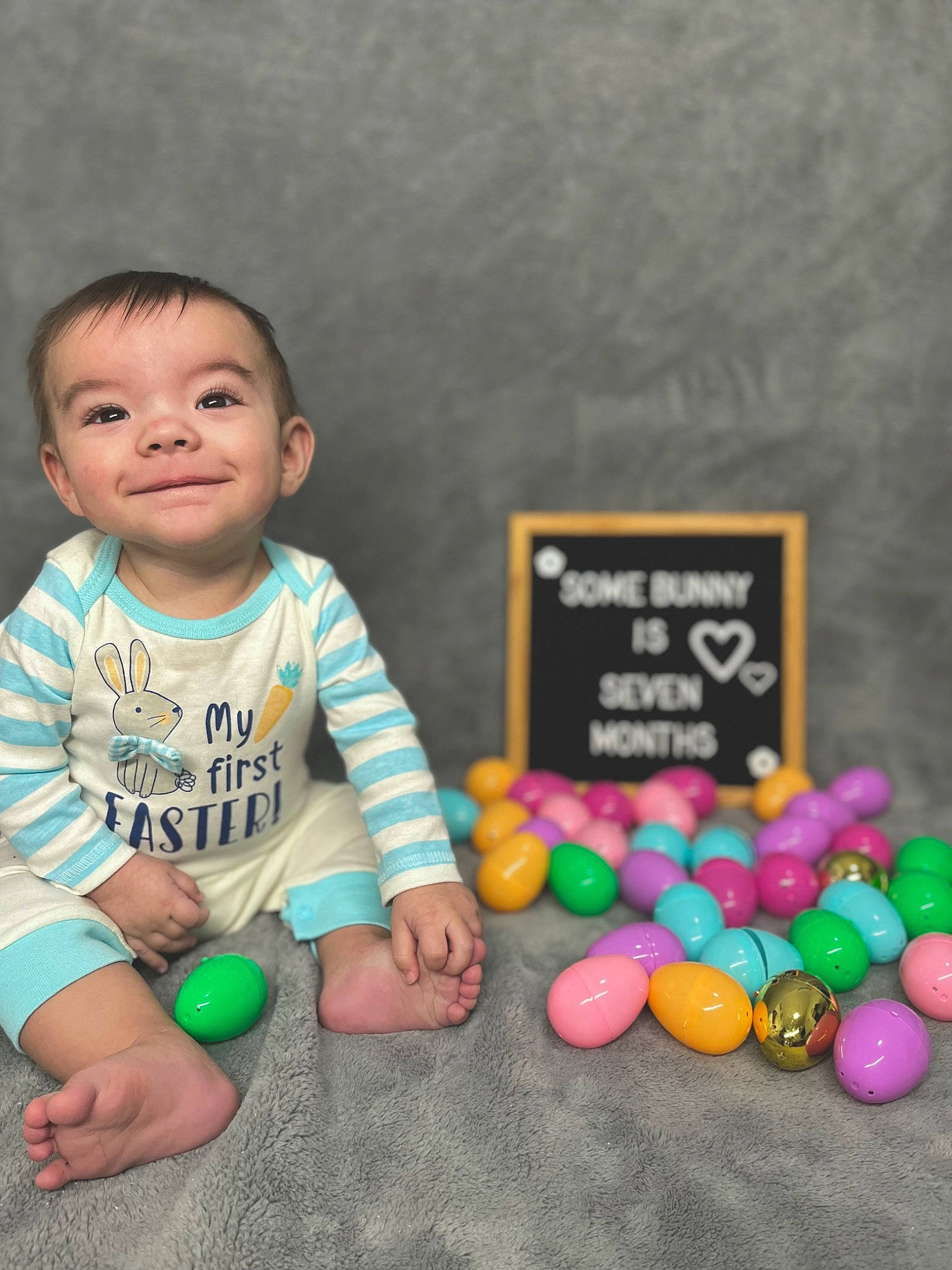 Cassius is registered to the contest to win money with this photo: baby, baby_playing_with_toys, baby_toddler_clothing, candy, child, circle, event, finger, font, fun, happy, joy, person, photography, play, portrait_photography, sitting, smile, sweetness, t_shirt