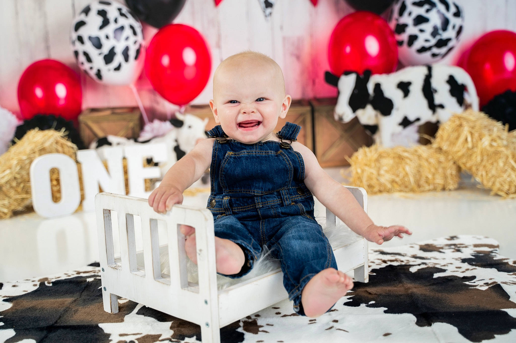 Lawson is registered to the contest to win money with this photo: baby, baby_toddler_clothing, balloon, chair, child, couch, dress, event, fun, happy, party_supply, pattern, person, pink, red, smile, sweetness, t_shirt, toddler, toy