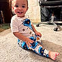 Roman joined the competition — help win amazing prizes! toddler, child, smiling, pajamas, cookie_monster, carpet, indoor, sitting, barefoot, happy, person, furniture, chair, wooden_furniture, floor, cute, young_child, playful, portrait, cozy