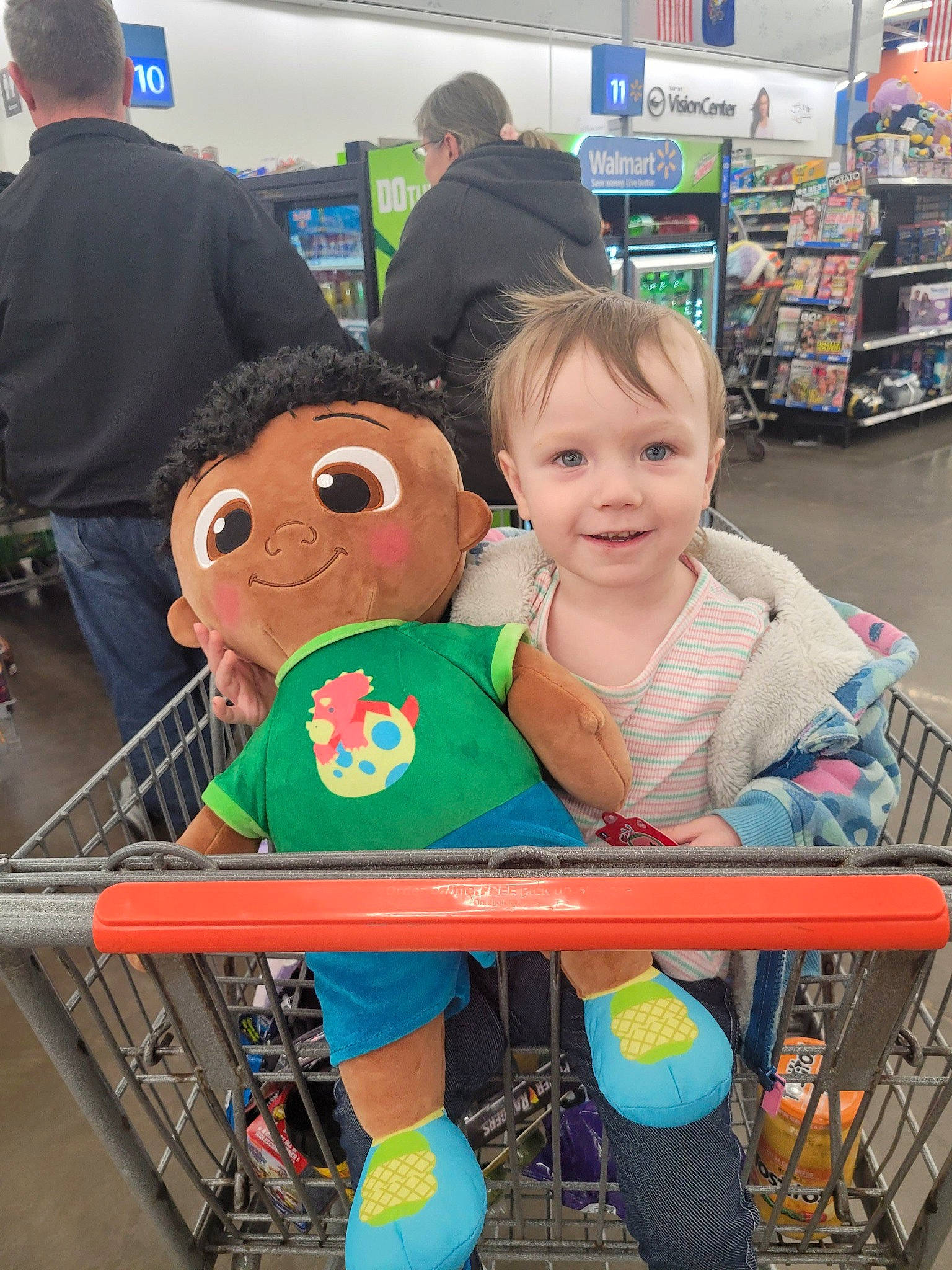 Izabella is registered to the contest to win money with this photo: cart, child, clothing, customer, event, fun, green, head, joy, leisure, person, product, public_space, retail, shelf, shopping, shopping_cart, smile, standing, t_shirt