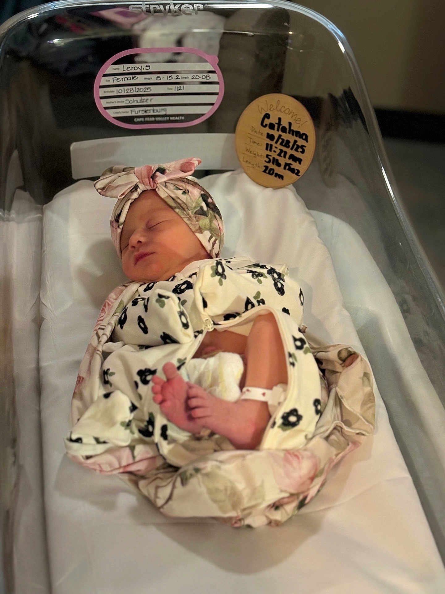Catalina is registered to the contest to win money with this photo: newborn, baby, infant, sleeping, hospital, bassinet, blanket, headband, foot, wristband, floral, bed, patient, person, indoor, cute, rest, soft, wrapped, peaceful