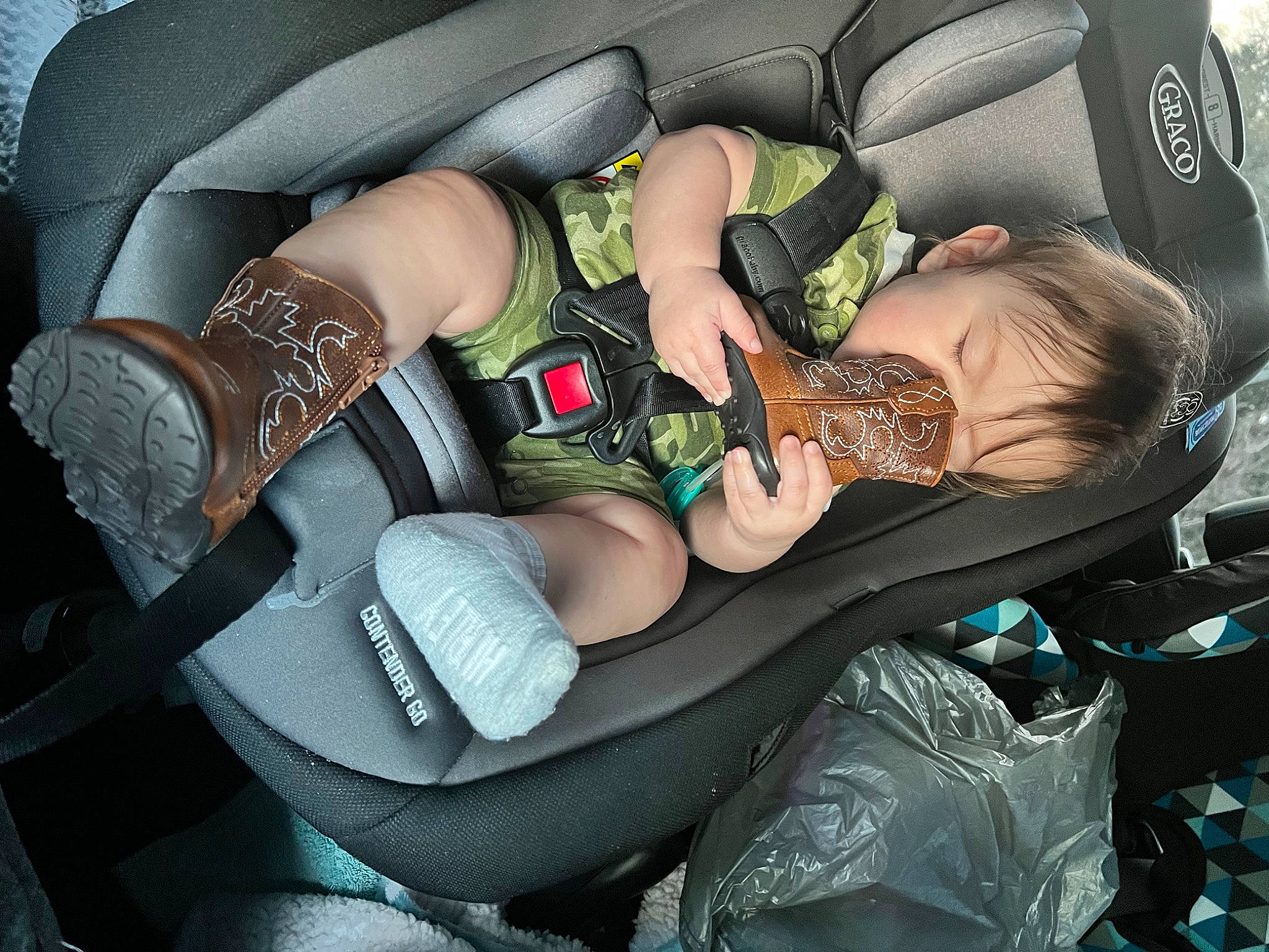 Wyatt is registered to the contest to win money with this photo: arm, auto_part, automotive_design, automotive_exterior, baby_in_car_seat, bag, car_seat, car_seat_cover, comfort, family_car, finger, hand, head_restraint, human_leg, knee, motor_vehicle, nail, person, steering_part, thigh
