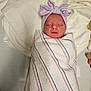 Makayla is registered to the contest to win money with this photo: newborn, baby, sleeping, wrapped, blanket, striped_blanket, hat, bow_hat, pink, blue, hospital, bed, soft, fabric, infant, cute, peaceful, portrait, child, resting