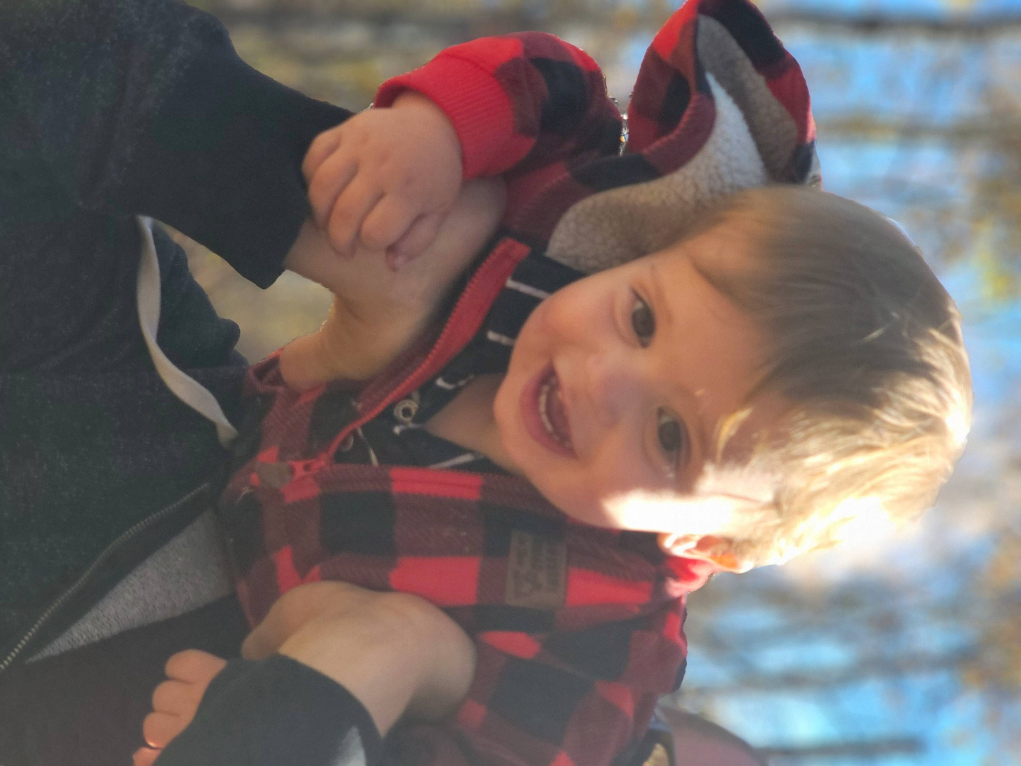 Declan is registered to the contest to win money with this photo: baby, carmine, child, eye, fun, grass, happy, head, holiday, joy, leisure, pattern, person, plaid, plant, red, sitting, smile, tartan, toddler