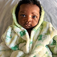 Jadon joined the competition — help win amazing prizes! baby, bed, blanket, blue_eyes, child, closeup, cozy, curly_hair, cute, face, fluffy_clothing, indoor, infant, looking_at_camera, portrait, robe, skin, soft_texture, warm, young_child
