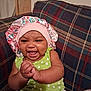 Ro'Miyah joined the competition — help win amazing prizes! baby, infant, child, smiling, laughing, bonnet, hat, green_onesie, polka_dot, hands, plaid_couch, upholstery, living_room, indoor, portrait, happy, skin, seated, cozy, expression