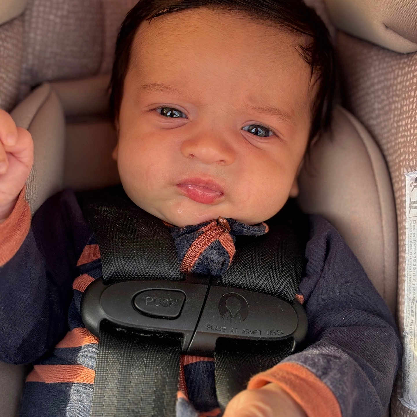 Koen is registered to the contest to win money with this photo: accessories, baby, belt, bodypart, car, car_interior, carseat, cushion, face, finger, gun, hand, head, homedecor, person, photography, portrait, transportation, vehicle, weapon