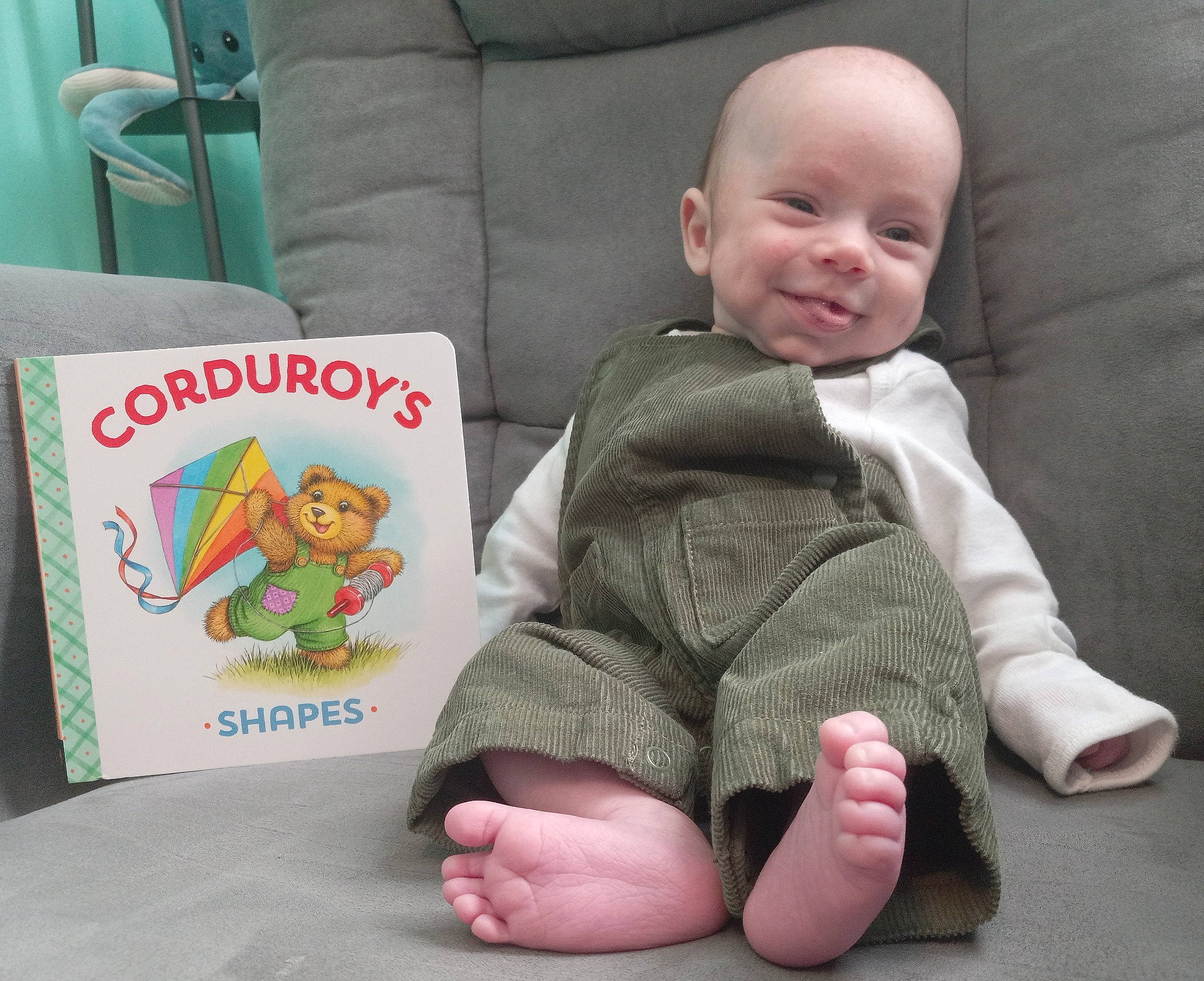 Holden is registered to the contest to win money with this photo: baby, baby_toddler_clothing, cheek, child, comfort, facial_expression, finger, gesture, happy, joy, leg, mammal, people, person, product, skin, sleeve, smile, snapshot, textile