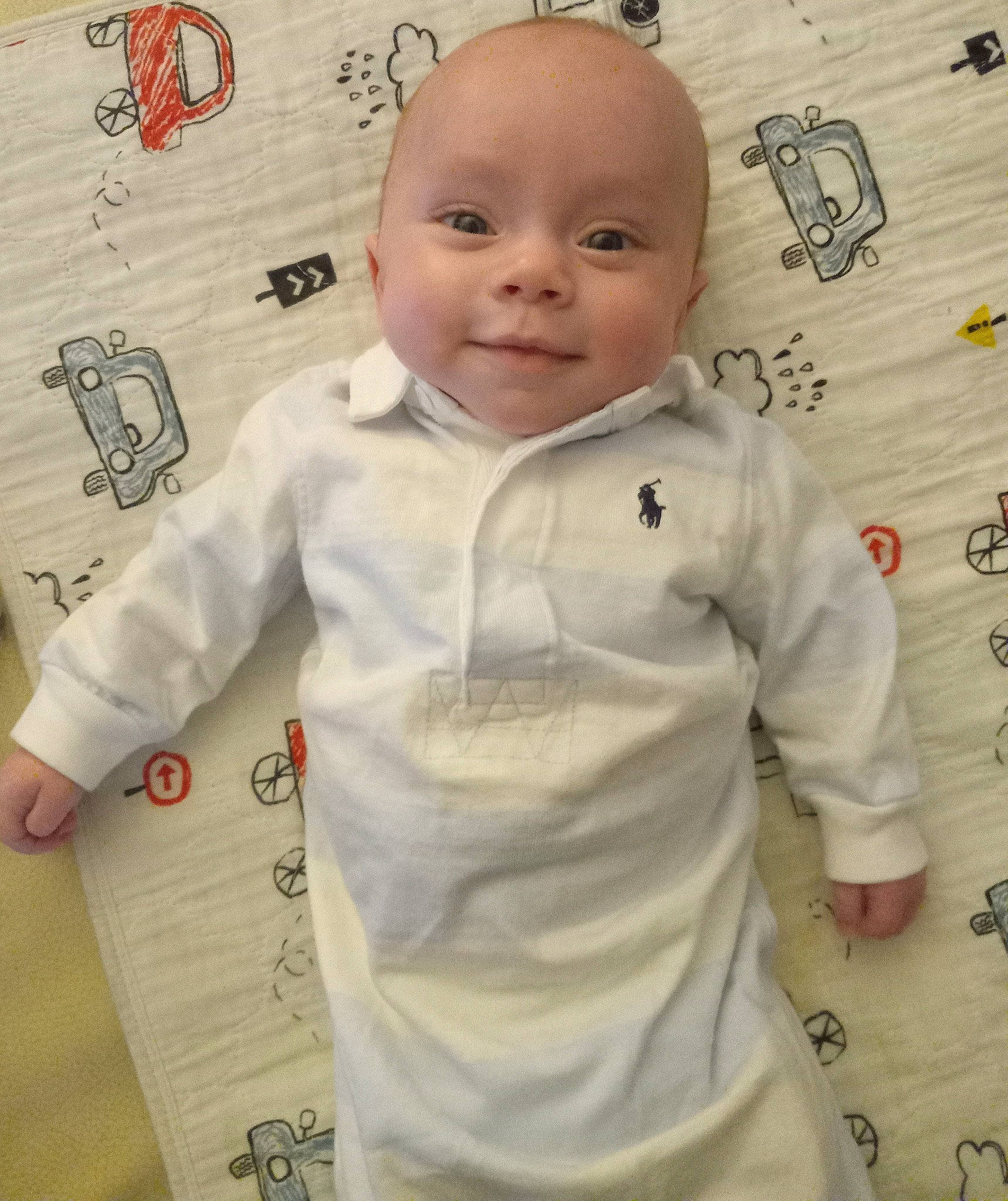 Holden is registered to the contest to win money with this photo: art, baby, baby_toddler_clothing, cheek, child, flooring, gesture, happy, illustration, linens, long_sleeved_t_shirt, nose, outerwear, pattern, person, room, sleeve, smile, t_shirt, toddler