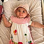 Siana a rejoint le concours — aidez-le/la à gagner de superbes lots ! baby, infant, child, hat, pink_dress, flower_print, bug_print, cushion, bottle, baby_care, soft_toy, face, portrait, lying_down, indoors, cute, calm, curious, person, apparel