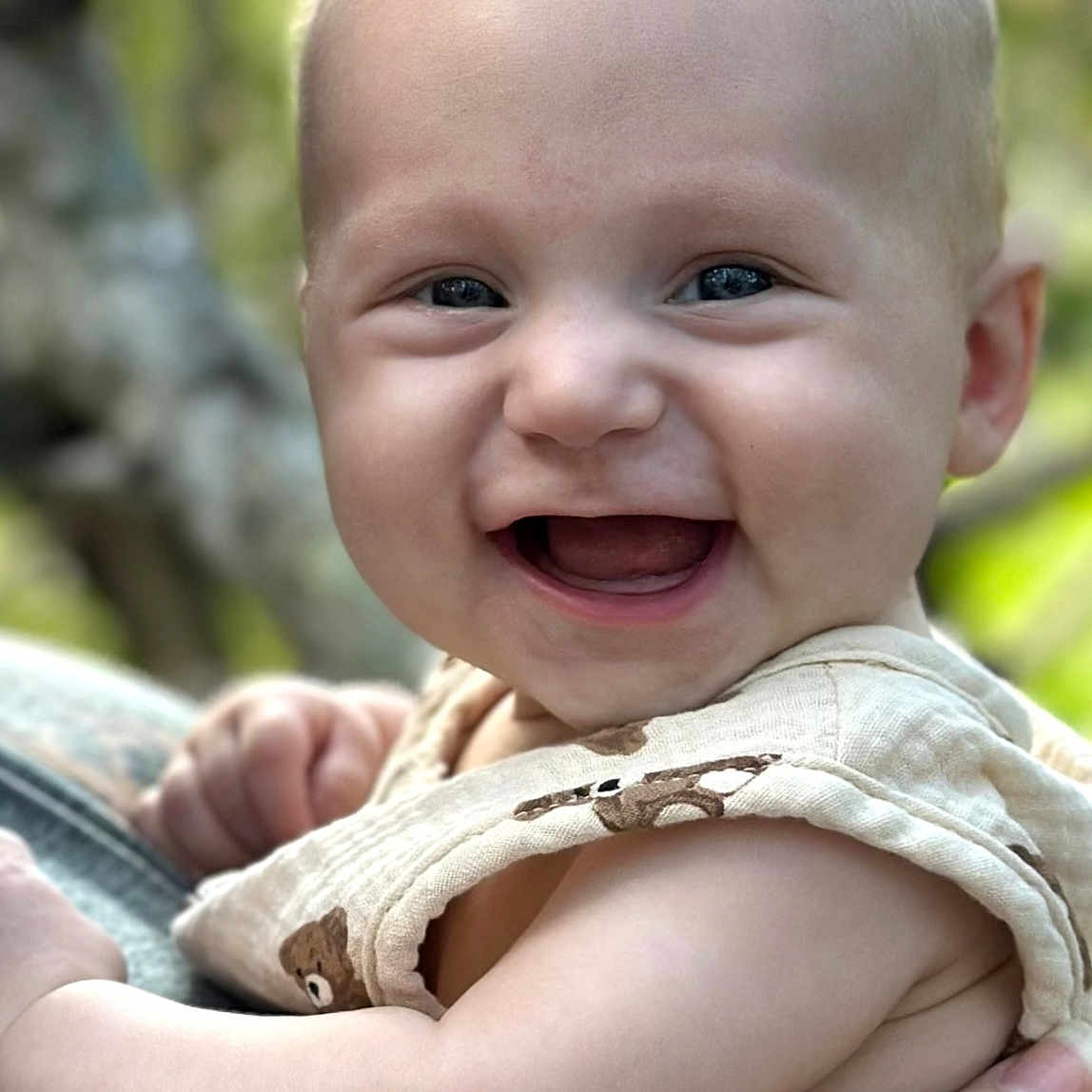 Kane joined the competition — help win amazing prizes! accessories, baby, babylaughing, bodypart, clothing, dress, face, happy, head, jewelry, laughing, mouth, necklace, newborn, pants, person, photography, portrait, smile, teeth