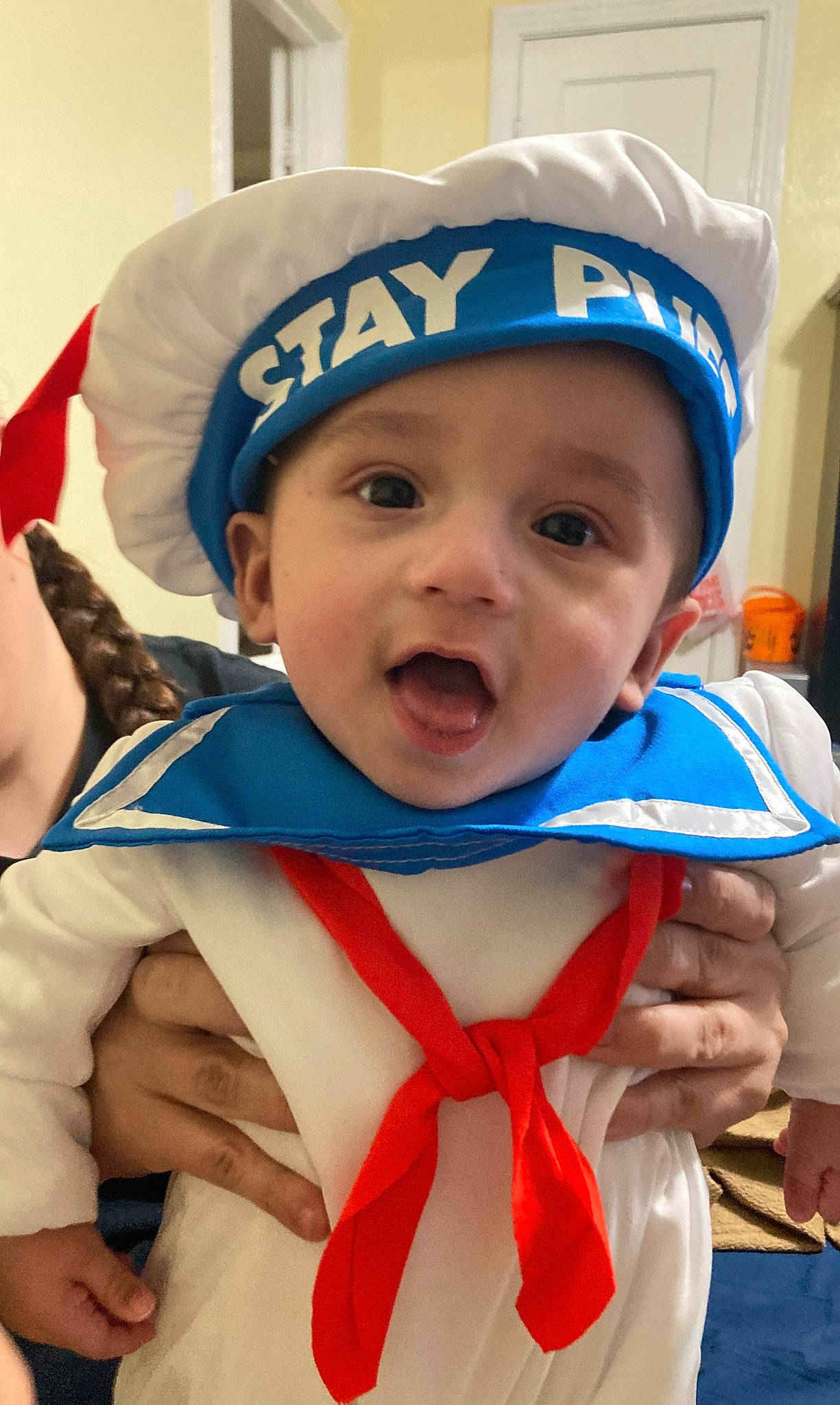 Jullian is registered to the contest to win money with this photo: azure, baby, baby_toddler_clothing, cap, child, electric_blue, event, facial_expression, fashion_accessory, finger, fun, gesture, hand, happy, headwear, mouth, person, personal_protective_equipment, recreation, smile