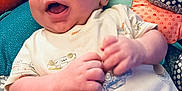 Ezekiel joined the competition — help win amazing prizes! baby, infant, smiling, happy, clothing, cushion, pattern, colorful, cute, hands, face, child, indoor, comfort, soft, portrait, young, joy, expression, person