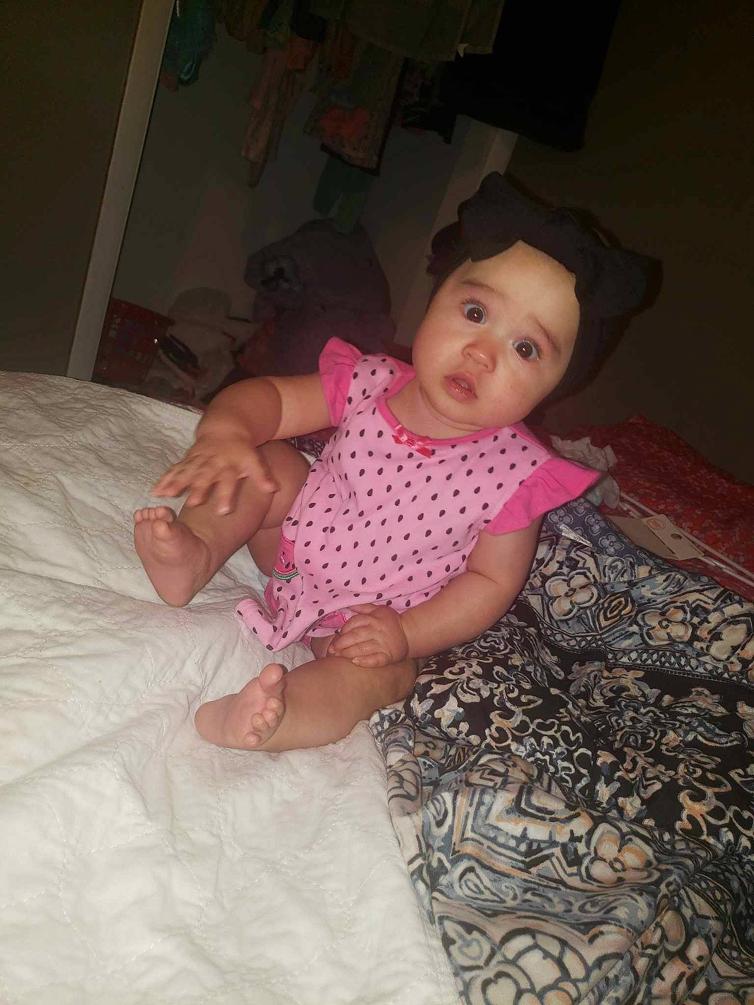 Honesty joined the competition — help win amazing prizes! arm, baby, baby_toddler_clothing, child, comfort, flash_photography, flooring, fun, hat, headwear, human_leg, linens, magenta, pattern, person, pink, room, sitting, skin, sleeve