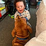 Reesie joined the competition — help win amazing prizes! toddler, dog, indoor, carpet, pajamas, brown_dog, child, pet, interaction, happy, playing, collar, home, floor, person, animal, cute, friendship, smiling, young