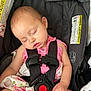 Jo Eva joined the competition — help win amazing prizes! baby, sleeping, car_seat, pink_clothing, child, safety_harness, infant, face, hand, seat_belt, resting, cute, young_child, protection, toddler, child_safety, fabric, pattern, closeup, peaceful