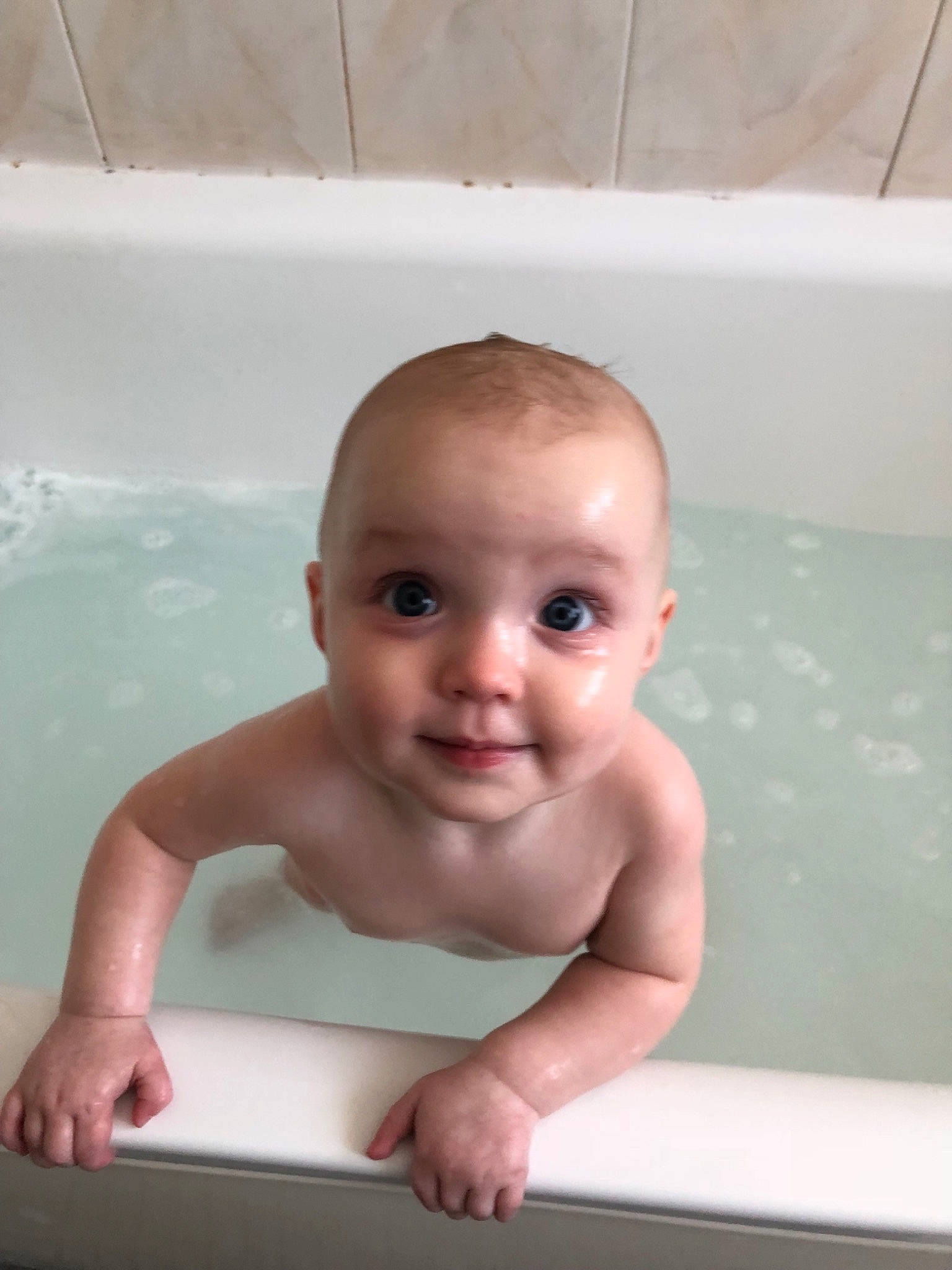 Sydney is registered to the contest to win money with this photo: baby, baby_bathing, bathing, bathtub, child, leisure, person, plumbing_fixture, product, skin, smile, toddler